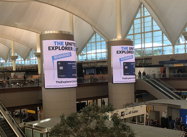 Large video screen displaying an ad in downtown square