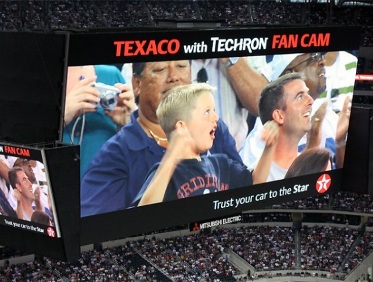 Large screen introducing a baseball player at a baseball game